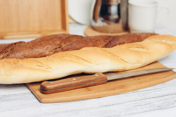 bread on a wooden table kitchen knife baking breakfast