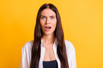 Portrait of shocked person open mouth staring camera cant believe isolated on yellow color...
