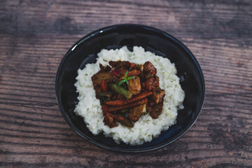 vegan thai stir fry with tofu and coconut milk rice, healthy plant-based food