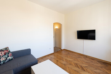 Interior of a living room with wooden parquet floor
