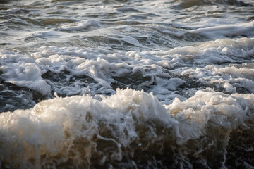 Sea wave close-up. Sea foam.