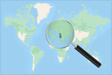 Map of the world with a magnifying glass on a map of Albania.