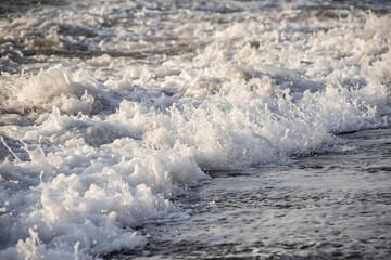 Sea wave close-up. Sea foam.