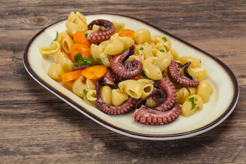 Pasta with octopus and yellow tomatoes