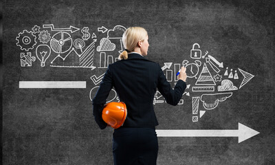 Businesswoman draws various business infographics