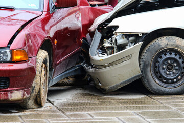 Car accident in the street. Smashed auto after car collision