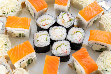Close-up slice of a roll with crab meat, fine texture of rice and meat.