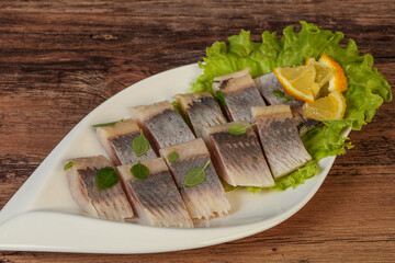 Herring fillet with sliced lemon