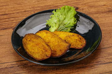 Baked potato with herbs and spices
