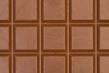 Macro photo of a sweet, delicious bar of chocolate photo taken from above