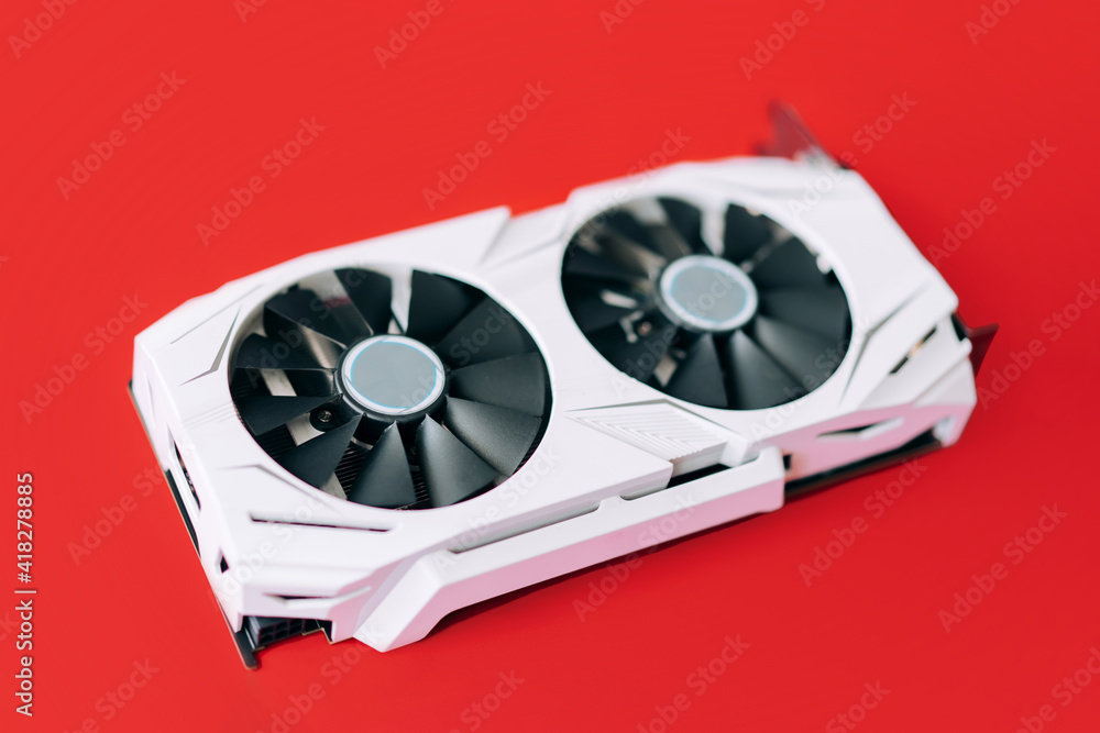 Aufkleber white graphics card with two black fans is located in the middle of red background. trending compute