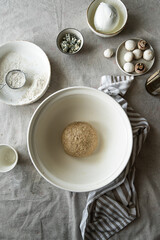 Step by step process of making wholegrain yeast dough for pizza. Kneaded dough before rising.