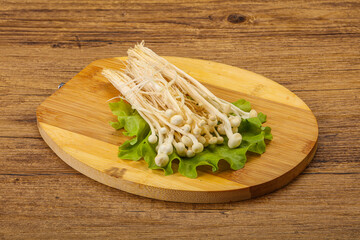 Raw Enoki mushrooms for cooking