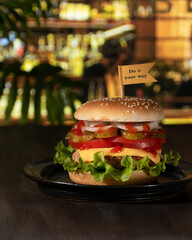 A hamburger on the table in the bar