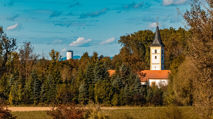 Beautiful autumn or indian summer view with a church and the famous water tower near Plattling,...