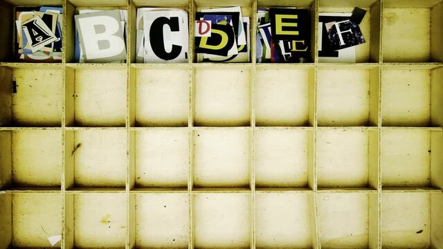 Stop motion Alphabet with cut out magazine letters  from above 