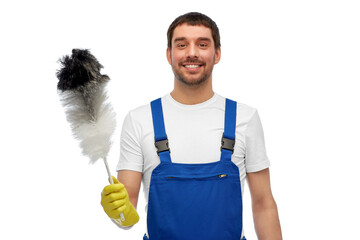 profession, cleaning service and people concept - happy smiling male worker or cleaner in overall...