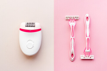 White epilator with pink razor. Epilation concept, removal of unwanted hair