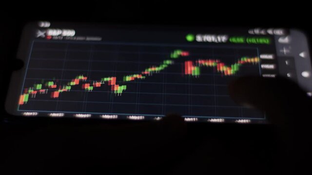 Stock Exchange, Trading Online, Trader Working With Smartphone on Stock Market Trading Floor. Man Touch Screen Reading Financial News, Browse Foreign Exchange Market Data, Chart Forex. Crypto currency