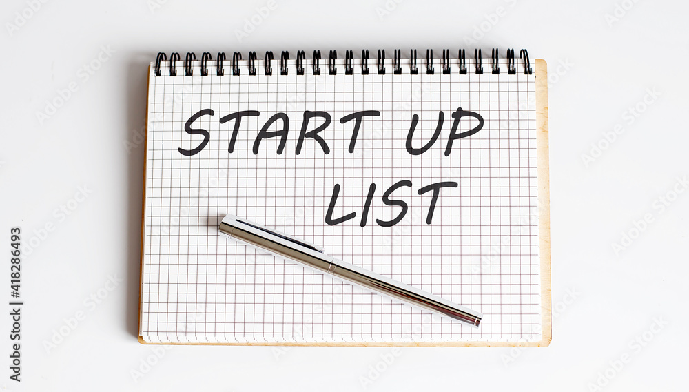 Poster start up list text on the notepad with pen