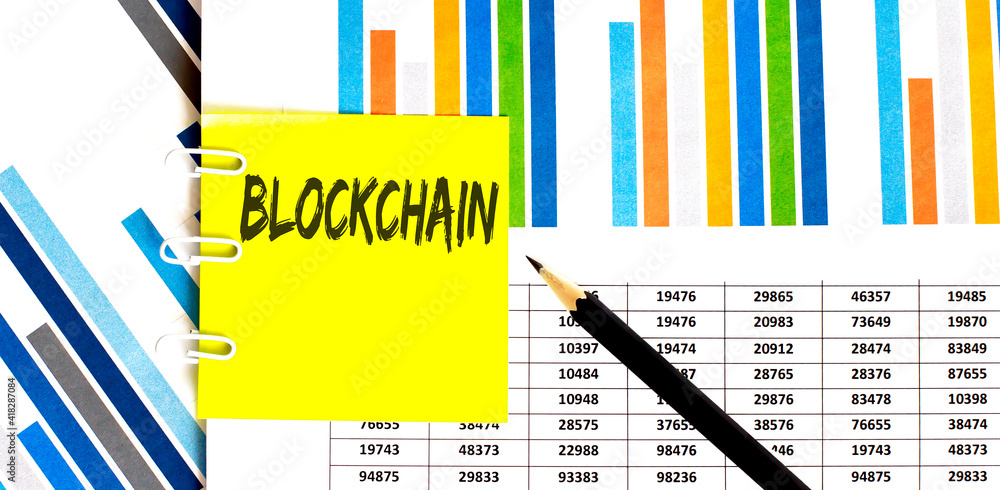 Poster yellow sticker with text blockchain on chart with pencil . it can be used as a business and financia