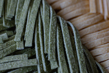green and yellow healthy egg noodles close-up