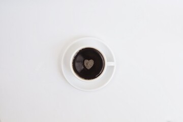 cup of coffee with heart on white background,