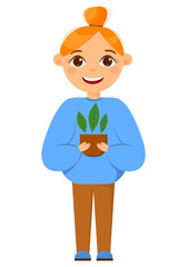 Gardening beautiful red-haired girl with a bun, holding a pot of seedlings. The girl is engaged in gardening.
