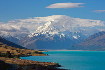 Mount Cook in evening light with clouds on summit