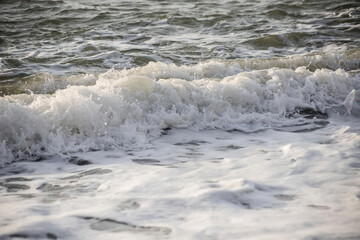 Sea wave close-up. Sea foam.