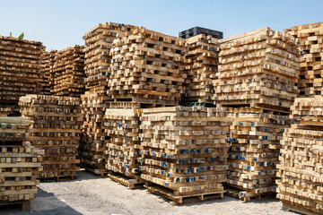 Stacks of used Wooden Pallets at a Recycling business area