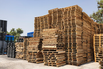 Piles of cargo pallets at a recycling business area