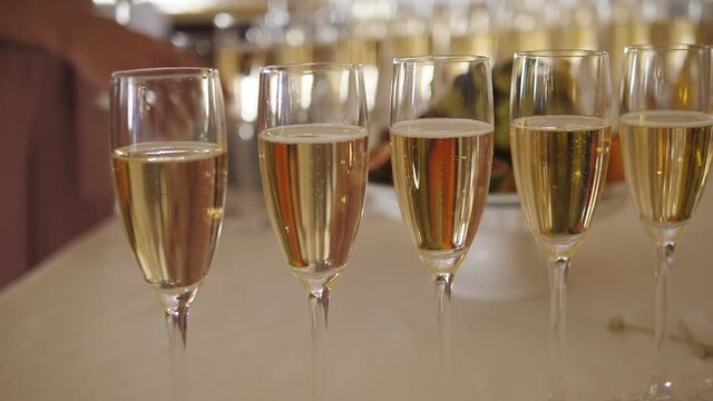 Buffet area at the event. Glasses of champagne are waiting for guests.