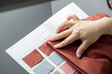 Detail of employee working in Chinese clothing factory