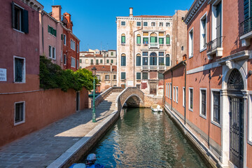 Fototapeta na wymiar Historic houses over beautiful canals. Venice, Italy