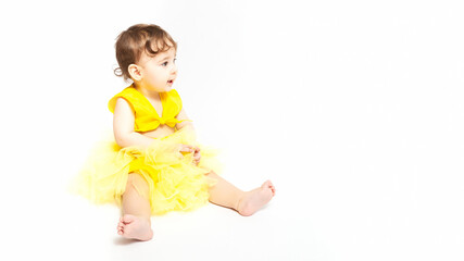 portrait cute baby in yellow dress