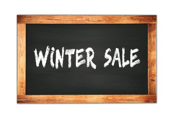 Obraz premium WINTER SALE text written on wooden frame school blackboard.