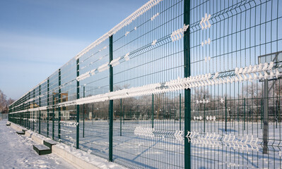 green metal fence frosty park landscape