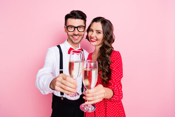 Photo of nice optimistic brown hair couple hold glasses wear trend cloth isolated on pastel pink color background