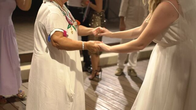 Bride Dancing With Her Mom At The Wedding Party