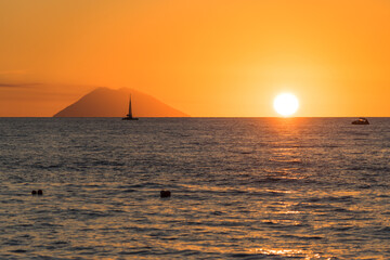 Mesmerizing scenery of sunset at Tropea beach with Stromboli island, Calabria, Italy