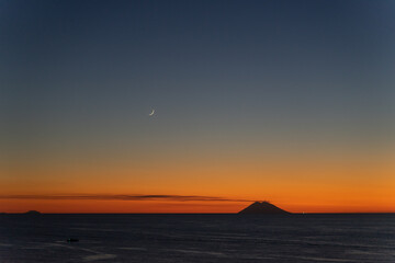 Mesmerizing scenery of sunset at Tropea beach with Stromboli island, Calabria, Italy