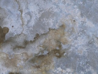 Old cement or concrete outdoor wall with stains and moldy for background.
