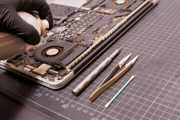 Battery replacement and repair with cleaning of a laptop with different backgrounds 