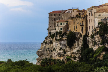Fototapeta na wymiar stone house on a clipp in tropea calabria in front of the ocean