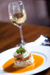 Glass of white wine and fish meal
