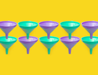 Colorful pattern of funnels. Creatice concept with copy space on yellow background.
