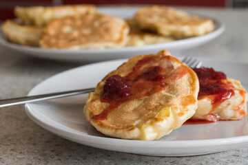 apple fritters on a white plate