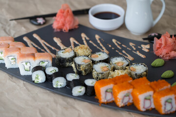 Different types of sushi and rolls in restaurant