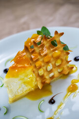 Classic cheesecake on white plate in rastaurant